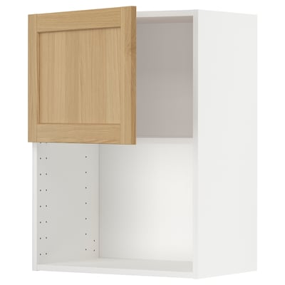 Armoire ouverte en placage de chêne de la série ikea METOD. Intérieur blanc, porte en bois clair, à charnière droite.