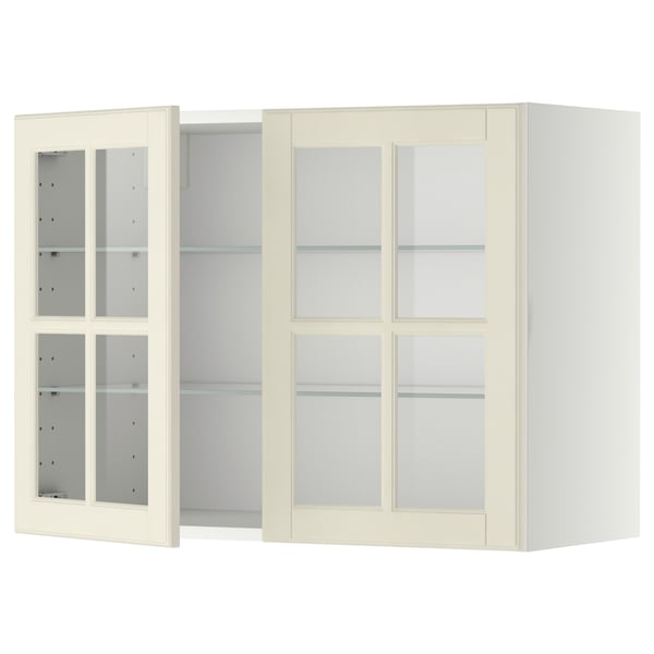Armoire de cuisine blanc cassé avec portes et étagères en verre.