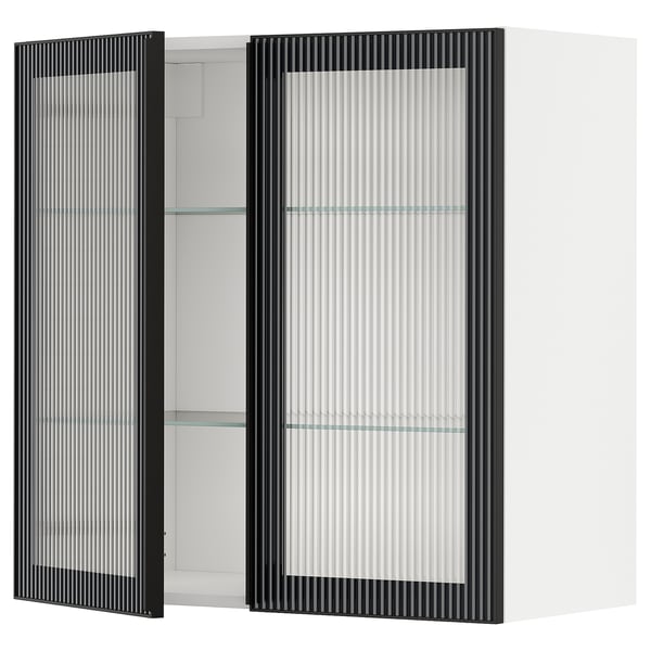 Armoire de cuisine noire moderne avec portes en verre dépoli et intérieur blanc, design rectangulaire et élégant.