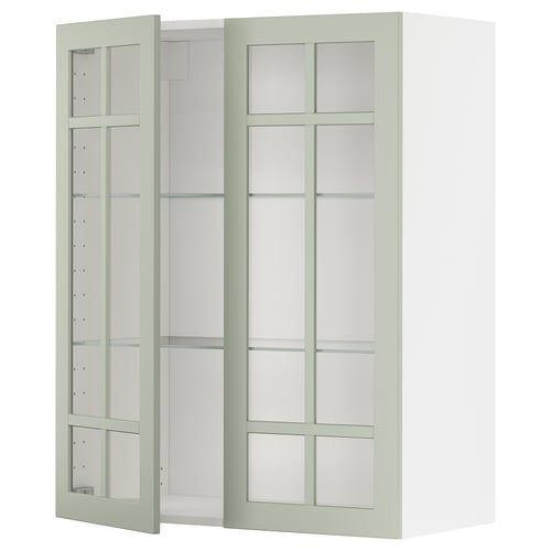 Armoire de cuisine Ikea METOD avec portes en verre vert et étagères réglables.
