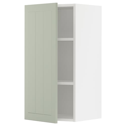 Armoire ouverte vert clair METOD avec étagères réglables.