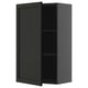 Armoire METOD noire avec étagère réglable.
