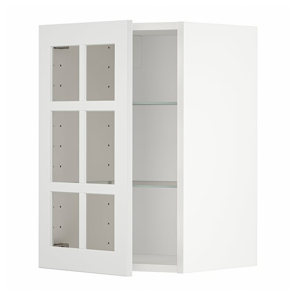 Un meuble de cuisine METOD blanc avec des portes vitrées, au design moderne et épuré.