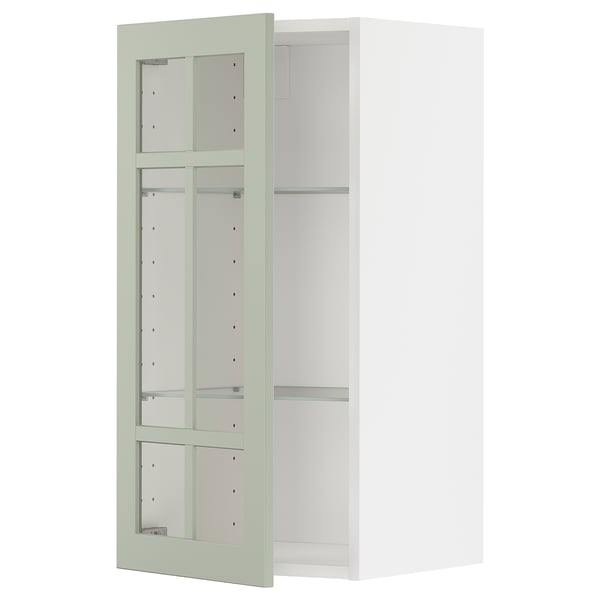 Armoire de cuisine METOD : portes en verre vert, cadre blanc, étagères réglables, design à 3 compartiments.