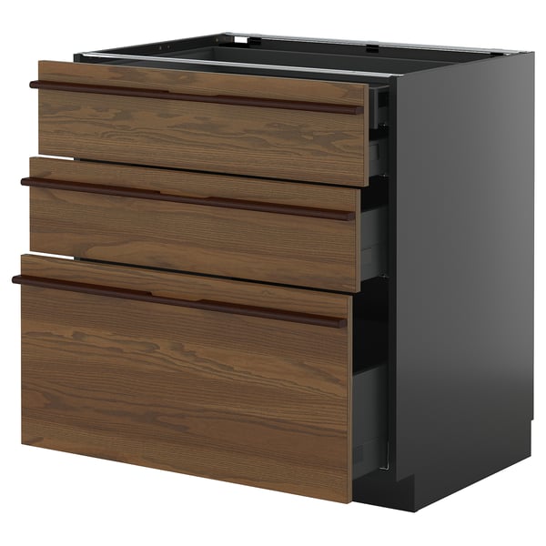 Unité de cuisine moderne, 3 tiroirs en bois brun sur armoire sombre, poignées élégantes.