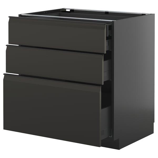 Armoire de cuisine noire moderne avec poignées lisses et plusieurs tiroirs.