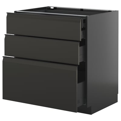 Armoire de cuisine noire moderne avec poignées lisses et plusieurs tiroirs.