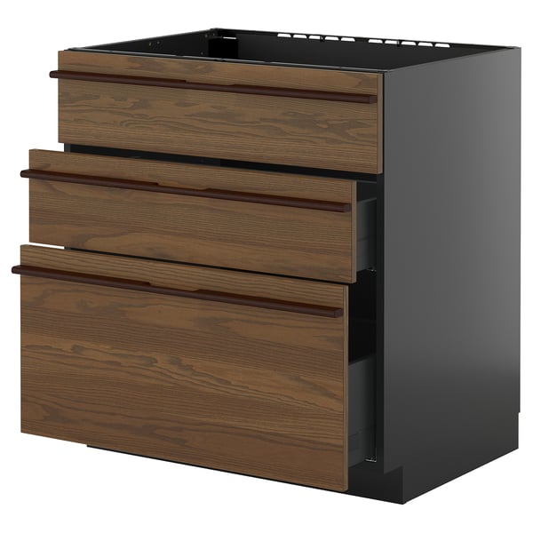 Cette image montre une armoire de cuisine ikea METOD avec des tiroirs en bois brun foncé et des côtés noirs élégants.