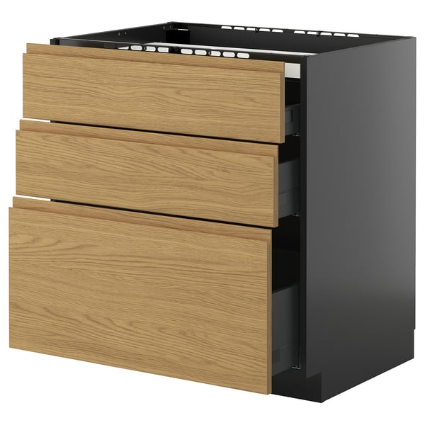 Unité de cuisine moderne, nommée METOD, avec tiroirs en chêne clair voxtorp et base gris foncé. Trois tiroirs, design élégant et minimaliste.