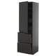 Armoire de cuisine moderne noire, haute avec tiroirs, finition mate élégante, poignées intégrées, étagères réglables.