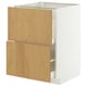 Un meuble de cuisine IKEA METOD blanc avec deux tiroirs en chêne clair. Le meuble est rectangulaire avec une finition lisse.