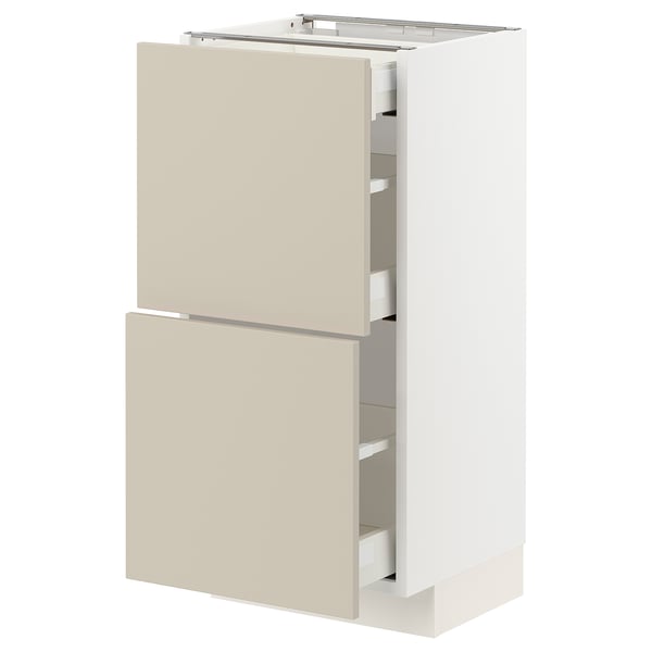 Meuble de cuisine METOD beige avec deux tiroirs et un meuble. Design minimaliste moderne. Cadre blanc, bords lisses.