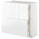 Armoire de cuisine moderne blanche très brillante avec poignées intégrées et tiroirs à fermeture douce.