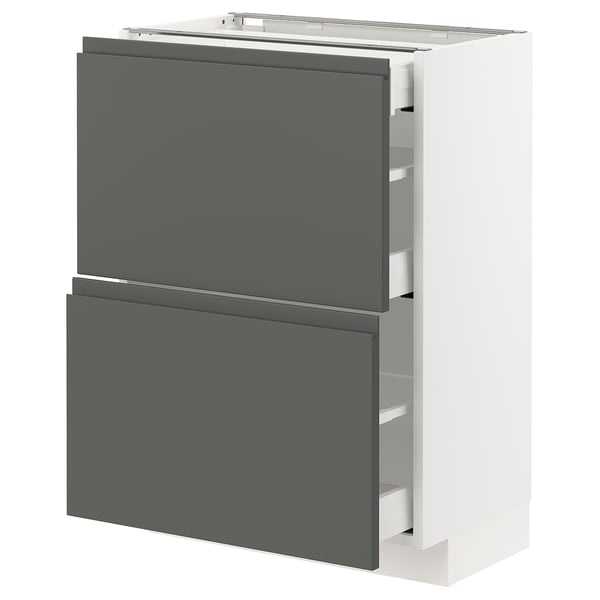Un module de cuisine METOD blanc avec des tiroirs gris foncé. Il s’agit d’un design élégant et moderne avec des poignées intégrées.