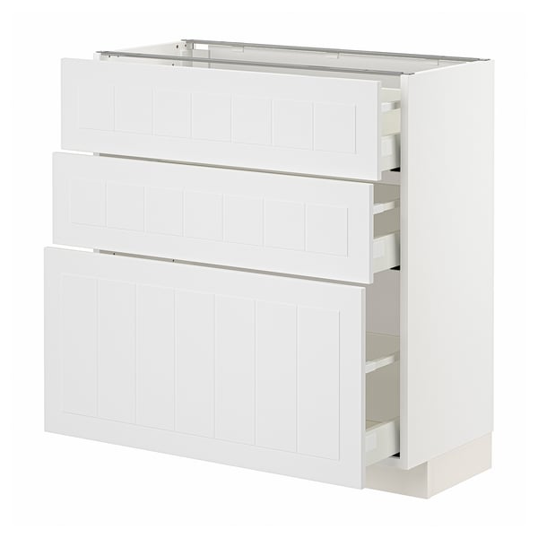 Armoire de cuisine METOD blanche avec trois tiroirs et panneaux verticaux.