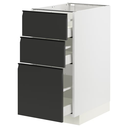 Armoire de cuisine METOD blanche moderne avec trois tiroirs noirs, des poignées élégantes et des lignes épurées.