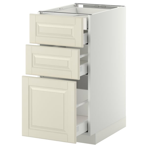 Un meuble de cuisine blanc METOD avec trois tiroirs blanc cassé et une porte, affichant un design classique avec des bords biseautés.