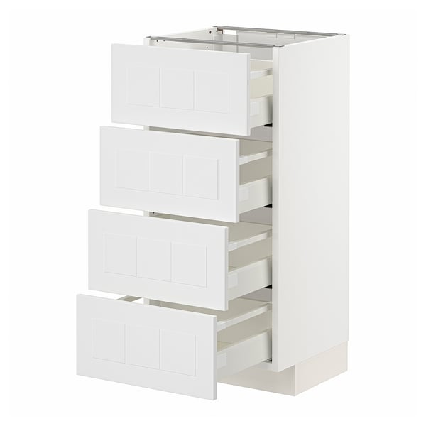 Armoire de cuisine Ikea METOD en blanc avec quatre tiroirs ouverts.