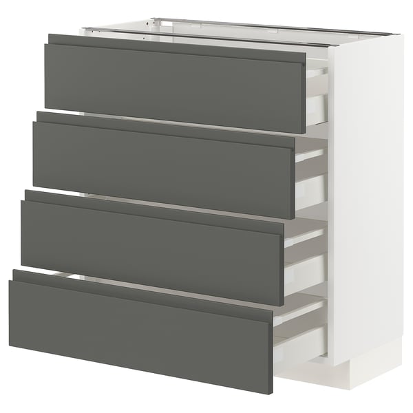 Façades de tiroirs grises sur armoire de cuisine blanche, design moderne et épuré, avec poignées intégrées et tiroirs à fermeture automatique.