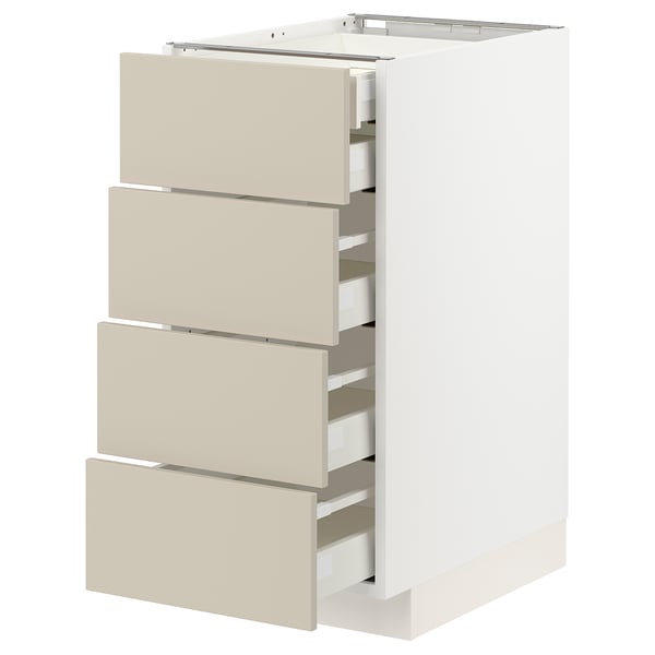 Un meuble de cuisine METOD blanc avec des tiroirs beiges. Il comporte plusieurs tiroirs au design lisse et minimaliste.