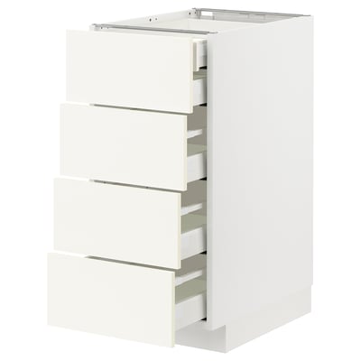 Armoire de cuisine METOD blanche avec quatre tiroirs ouverts, design minimaliste, bords lisses.