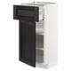 Armoire de cuisine moderne, blanche avec tiroir et porte noirs, étagères réglables, design élégant.