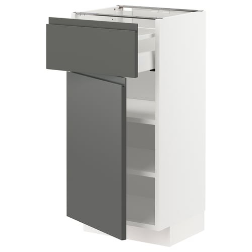 Un meuble de cuisine moderne METOD en blanc avec des tiroirs gris foncé, offrant un design élégant et contemporain.