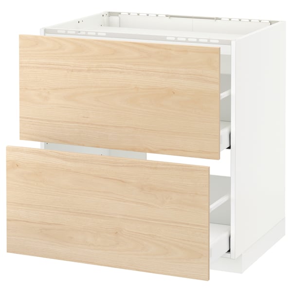 Unité de cuisine Ikea METOD avec tiroirs en frêne clair et cadre blanc.
