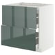 Armoire de cuisine moderne verte avec cadre et tiroirs blancs.