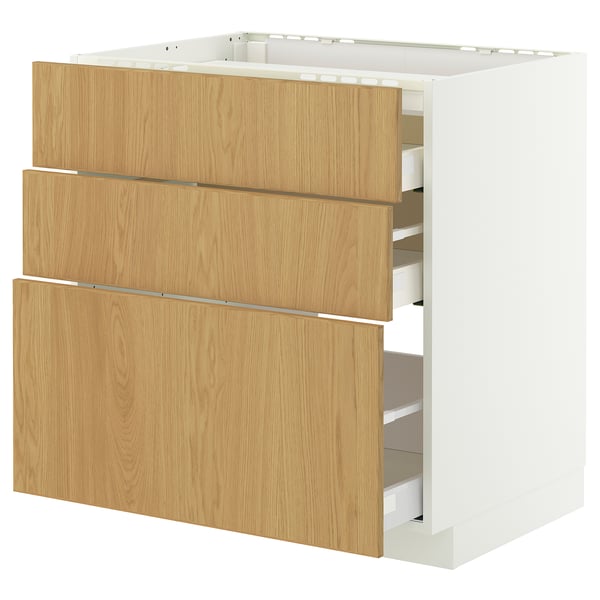 Une armoire de cuisine blanche et de couleur bois clair avec plusieurs tiroirs et un design épuré.