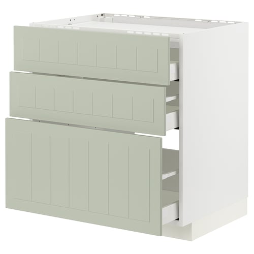 Armoire de cuisine blanche avec trois tiroirs verts et rainures verticales.