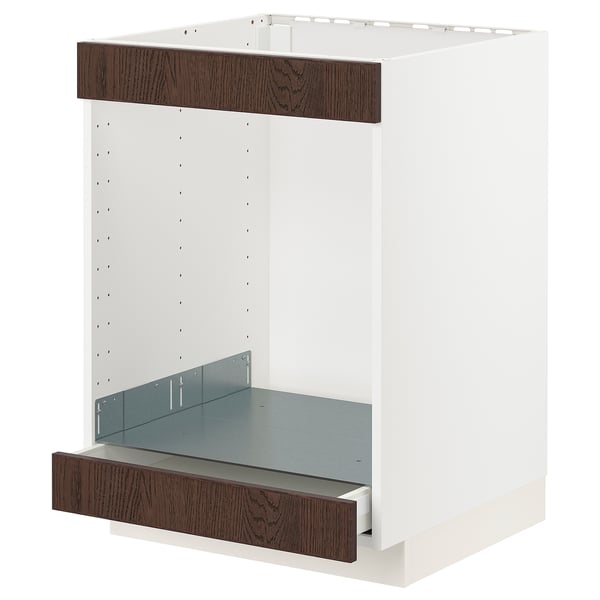 Le meuble de cuisine METOD avec un cadre blanc et des façades de tiroirs en bois sinarp brun foncé, y compris un tiroir bas.