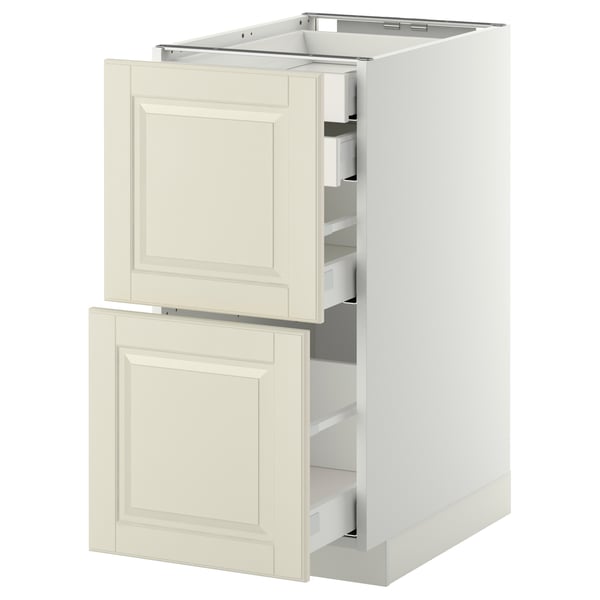 Un meuble de cuisine METOD blanc avec deux tiroirs bodbyn blanc cassé, au design traditionnel avec des bords biseautés.