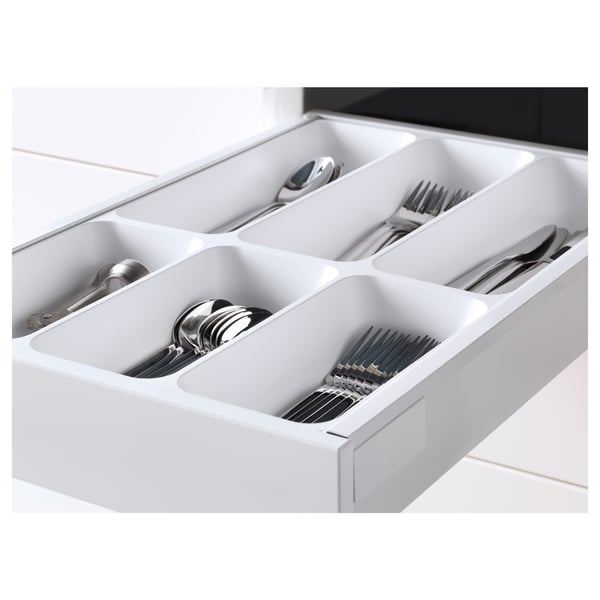 Organisateur de tiroir de cuisine blanc avec ustensiles en acier inoxydable, présentant plusieurs compartiments pour un rangement soigné.