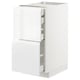 Une armoire de cuisine METOD blanche avec des tiroirs brillants et des poignées intégrées. Il a un design élégant et moderne.