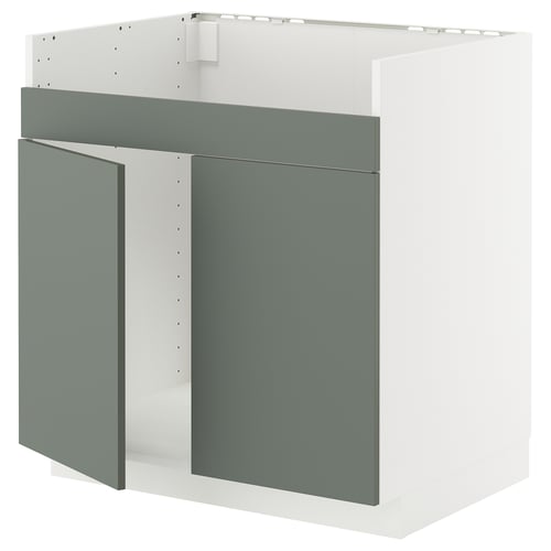 Un meuble de cuisine moderne METOD blanc avec des portes gris-vert. Le design épuré comprend des façades mates et une structure robuste.