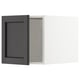 Armoire de cuisine en bois noir avec bords biseautés, ouverte montrant les étagères intérieures. Couleur sombre, forme rectangulaire, design classique.