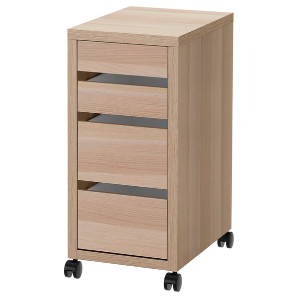 Un meuble de rangement roulant en bois léger MICKE au design épuré. Il dispose de quatre tiroirs sur roulettes pour un déplacement facile.