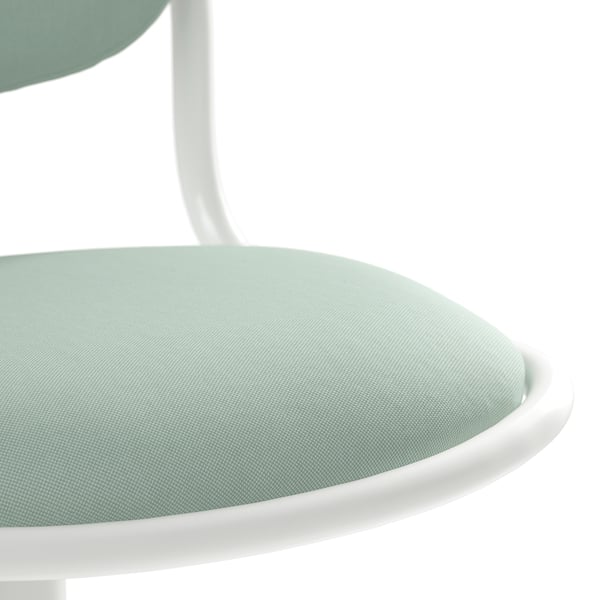 Une surface d’assise ronde et rembourrée, probablement d’une chaise moderne, dans un tissu vert pastel, soutenue par un cadre en métal blanc.