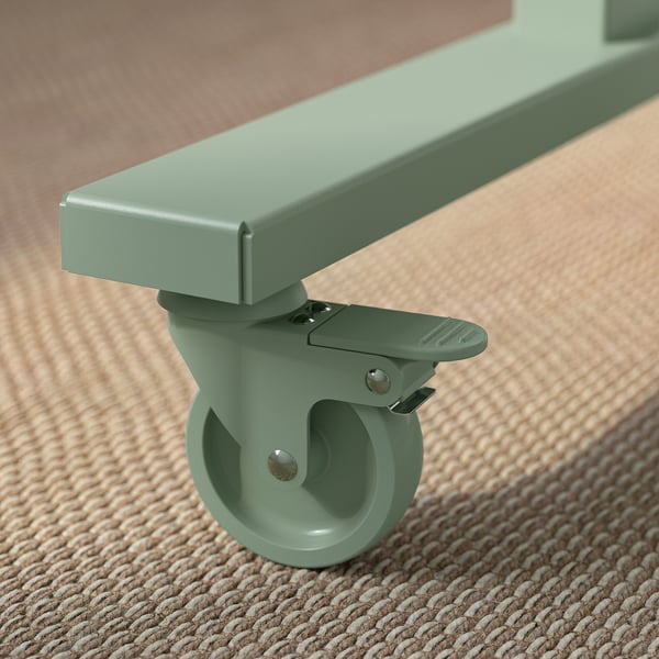 Pied de table roulant vert avec roue verrouillable et construction robuste.