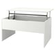 Une table basse ÖSTAVALL en blanc avec plateau réglable, design moderne.