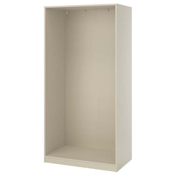 Un cadre d’armoire ikea PAX non assemblé de couleur crème, doté d’une forme rectangulaire simple avec des points sur les côtés pour un assemblage facile.