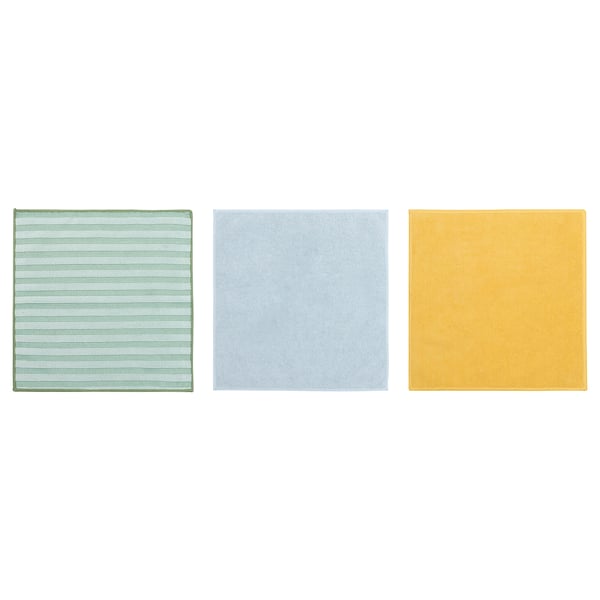 Trois chiffons de nettoyage carrés verts, bleu clair et jaunes, chacun avec une texture douce.