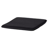 Un coussin POÄNG noir d’ikea. Il est rectangulaire, lisse et doté d’un détail de couture subtil sur le côté.