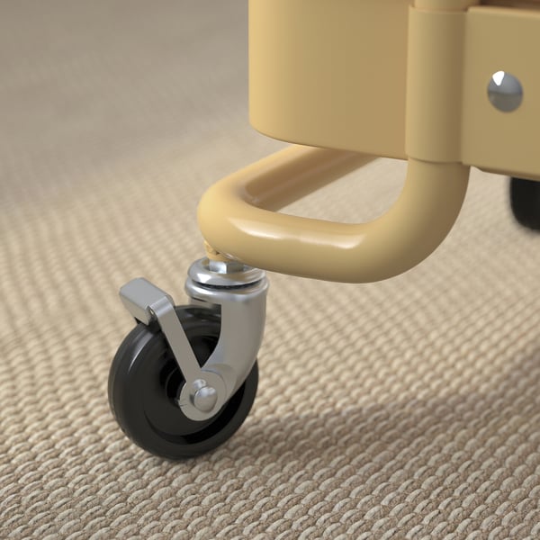 Roue du chariot en maille jaune. Roue métallique robuste avec frein, fixée au cadre jaune.