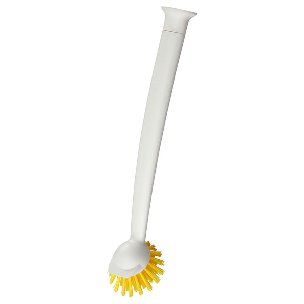 Représente une brosse à récurer RINNIG blanche avec un long manche et des poils jaunes, conçue pour nettoyer les surfaces de cuisine.
