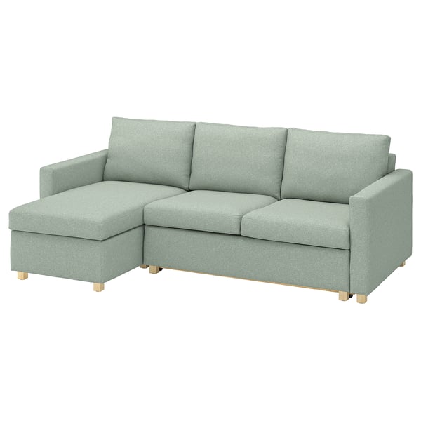 Un canapé-lit vert SALTSJÖBADEN avec une chaise longue. Son design est moderne et confortable, avec une housse amovible et lavable en machine.