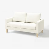 Canapé blanc SALTSJÖBADEN, design élégant et moderne, sièges en coussin, tissu à texture légère, pieds en bois.
