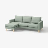 Canapé en L rembourré vert avec pieds en bois, design moderne et minimaliste.