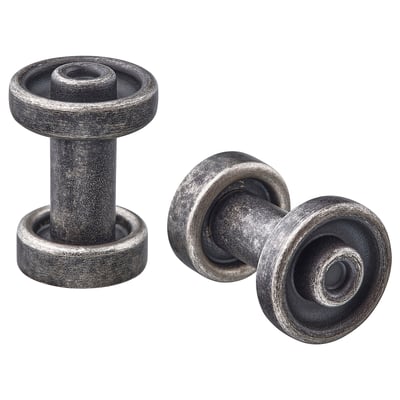 Deux boutons d’armoire ronds métalliques gris au design lisse.